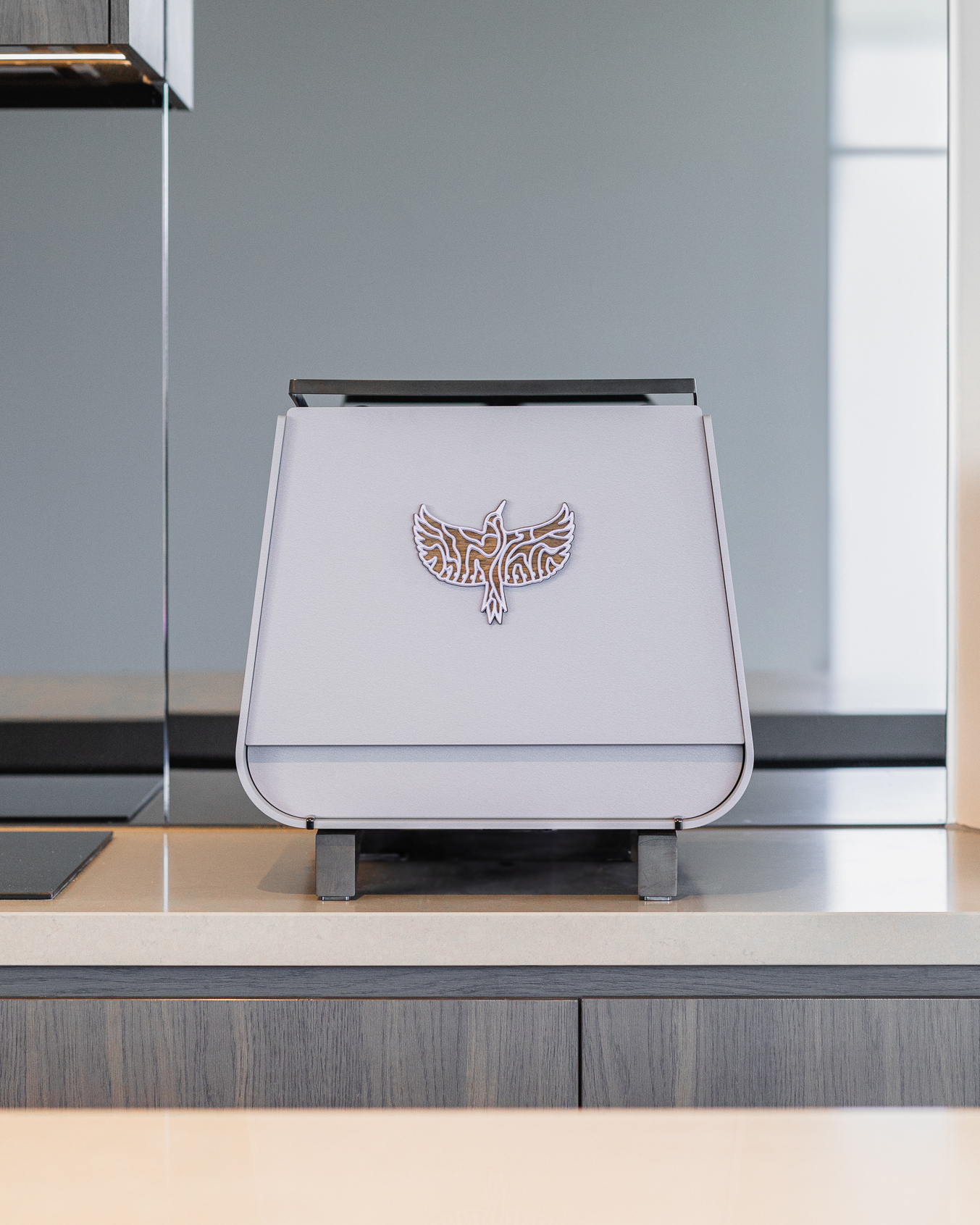 The back of Lavender Haze by Specht, a purple-grey Victoria Arduino Eagle One Prima EXP espresso machine. The outline of the Specht logo is prominent on the back.