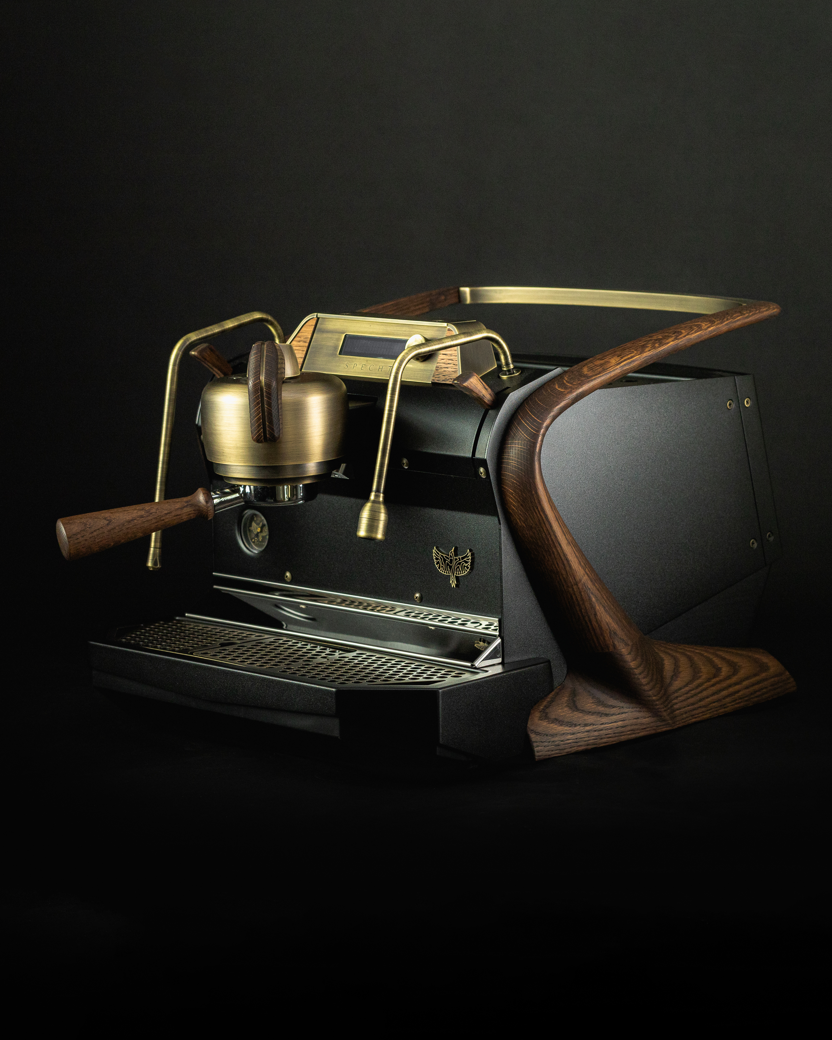 A bespoke, black Slayer Steam Single espresso machine with wooden walnut touchpoints and aged brass highlights.