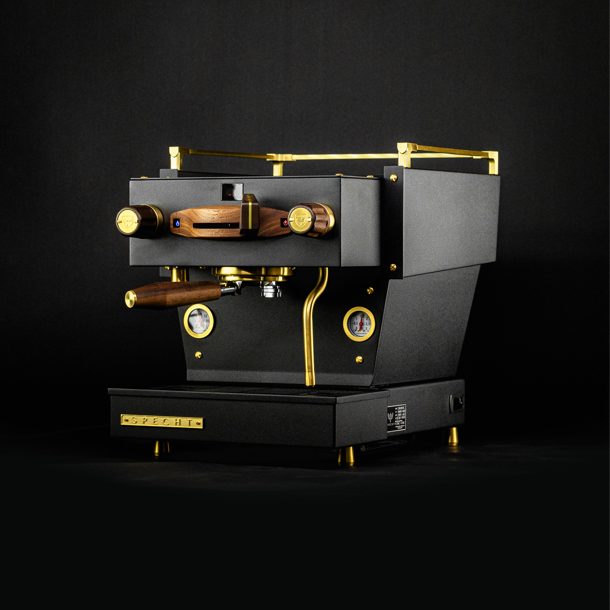 A bespoke black Linea Mini home espresso machine by Specht, with gold highlights and walnut touchpoints.