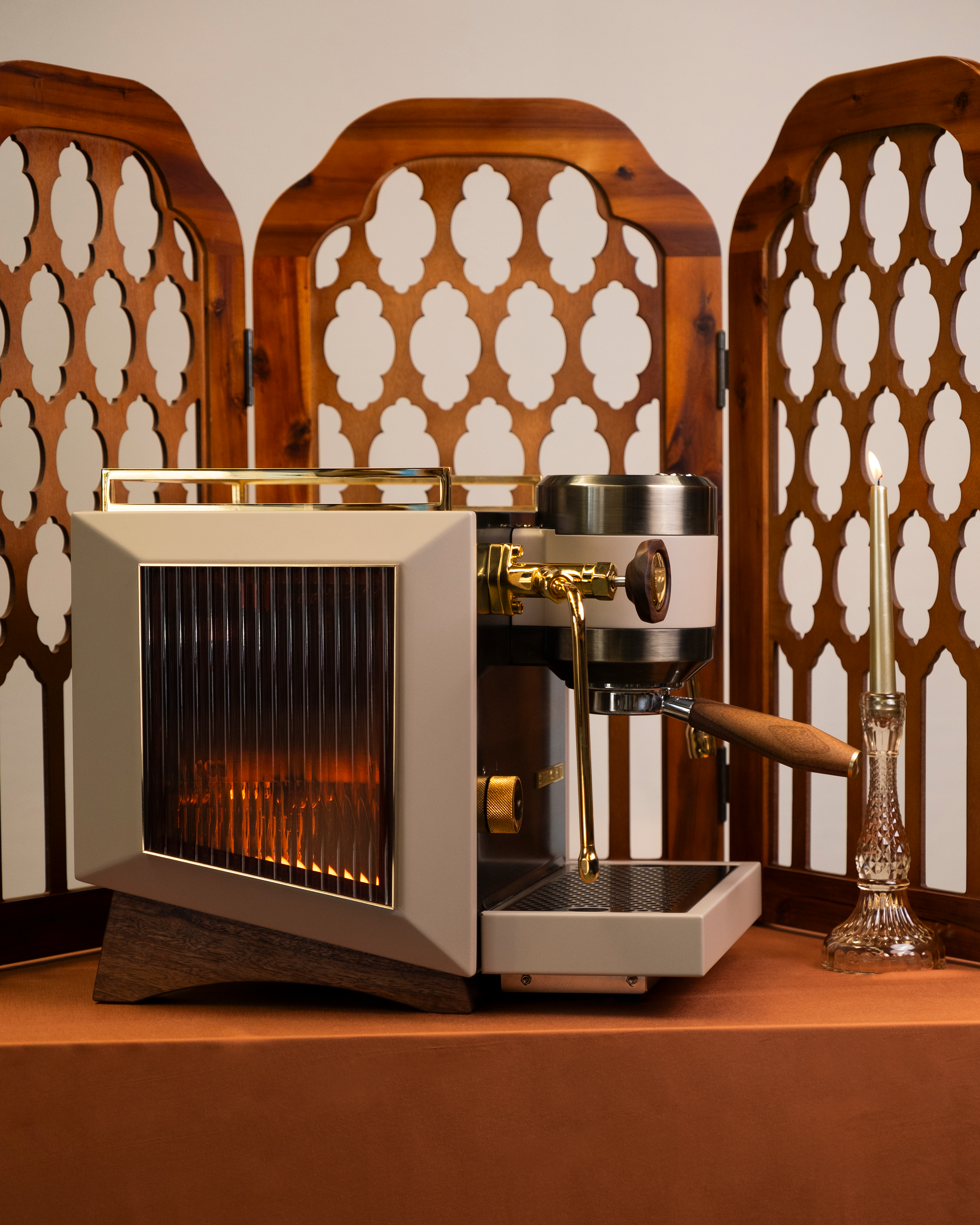 The amber-fluted, glass sides of a Rocket Bicocca home espresso machine, reimagined by Specht with pure 24-carat gold detailing and walnut touchpoints.