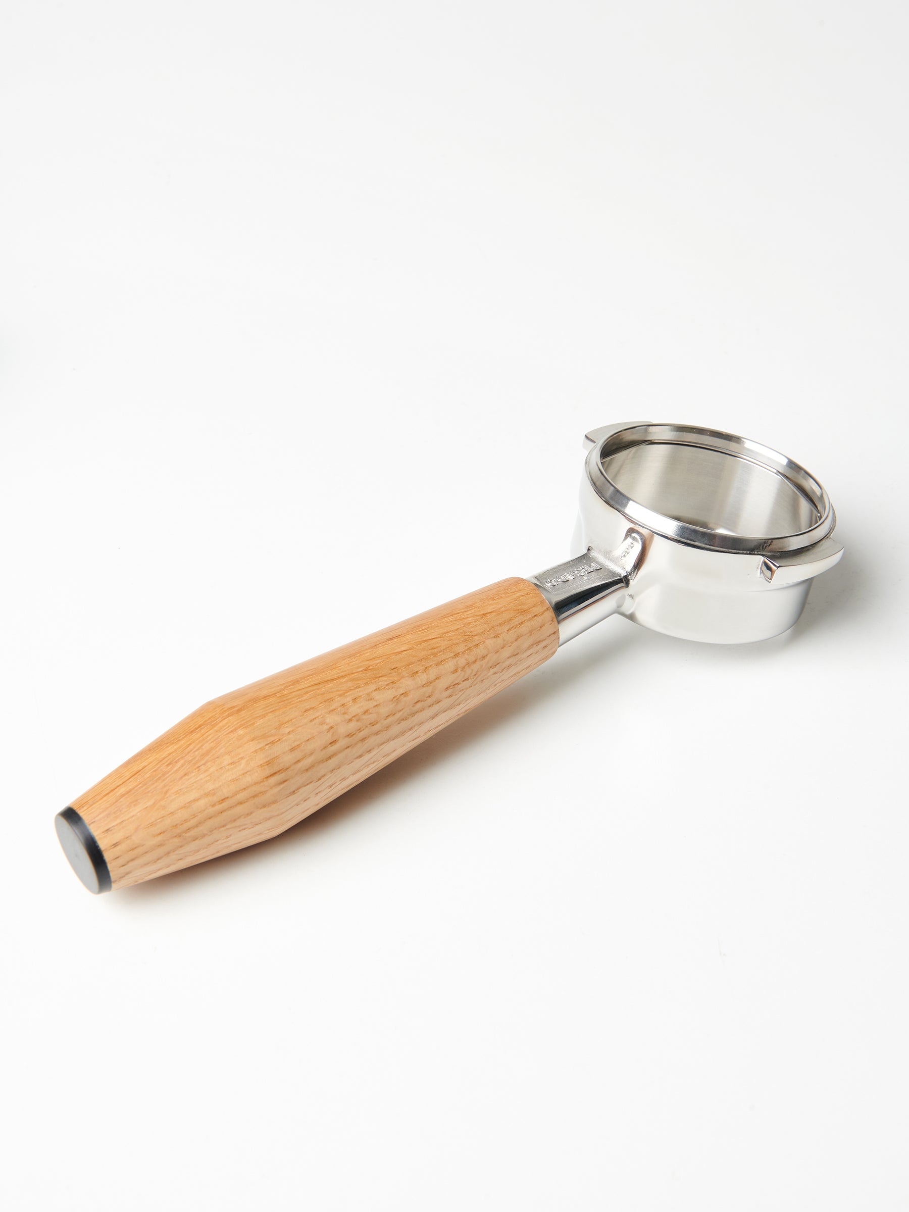 A bottomless Pesado portafilter with a Specht oak, black end-capped handle.