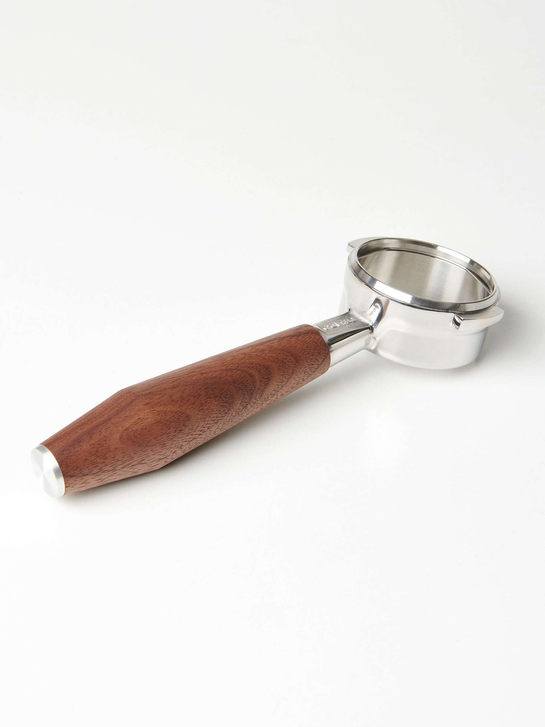 A bottomless Pesado portafilter with a Specht walnut, stainless steel end-capped handle.