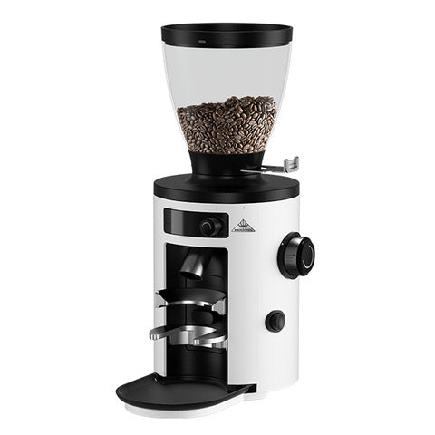 A white Mahlkonig X54 coffee grinder with coffee beans in its hopper.