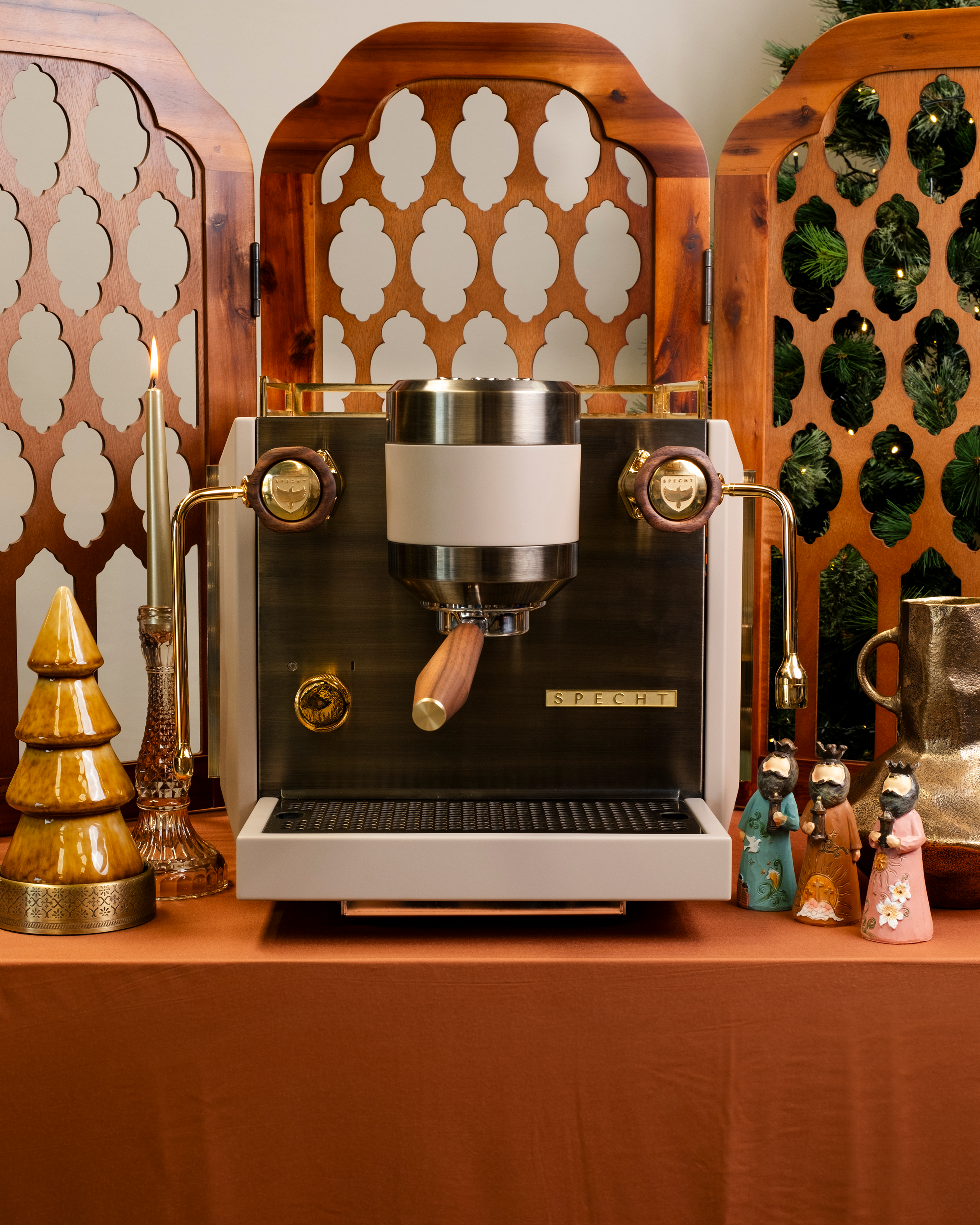 A white Rocket Bicocca home espresso machine, reimagined by Specht with pure 24-carat gold detailing and transparent amber-fluted glass sides.