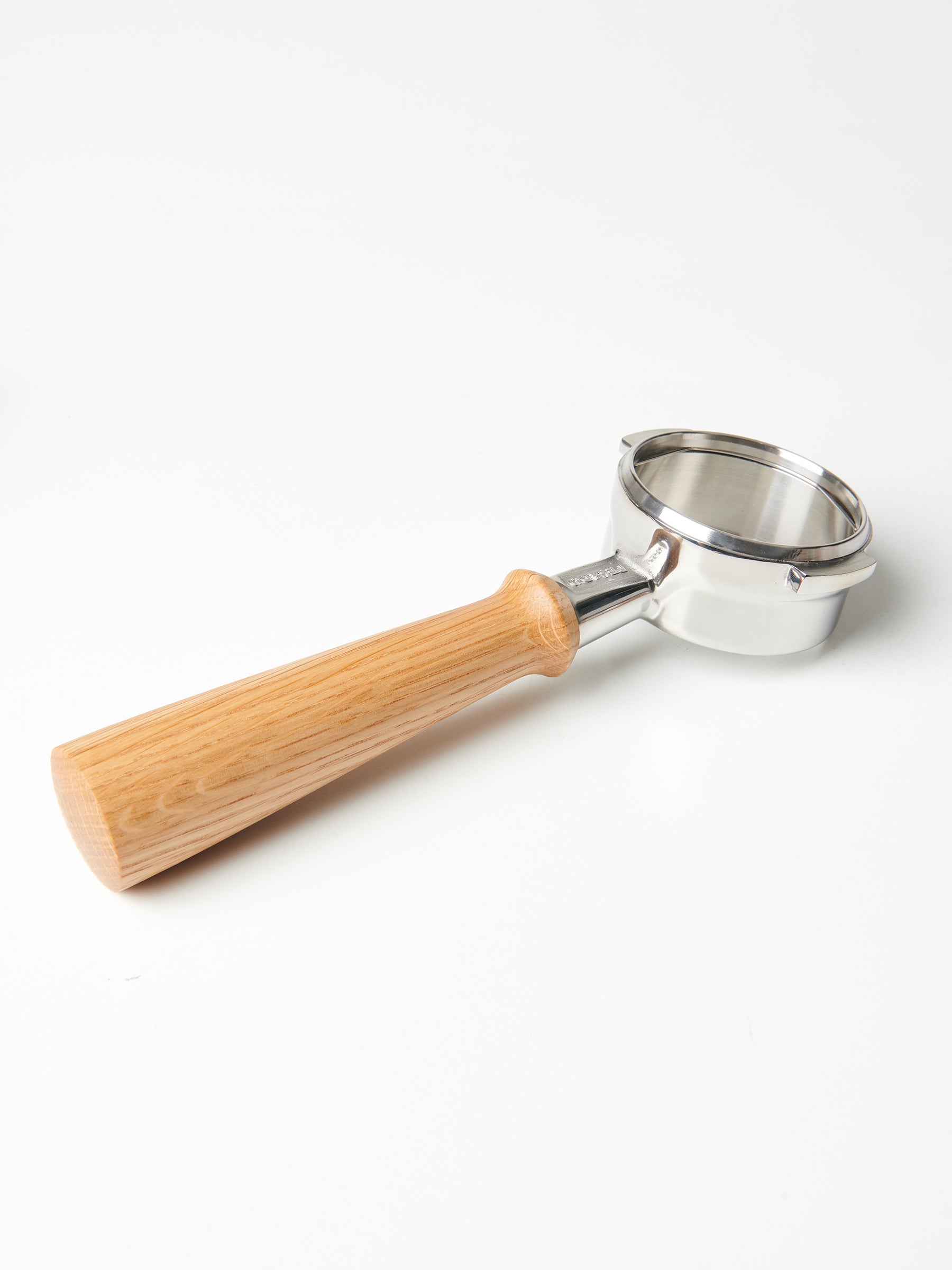 A bottomless Pesado portafilter with a Specht, Slayer-style oak wood handle.