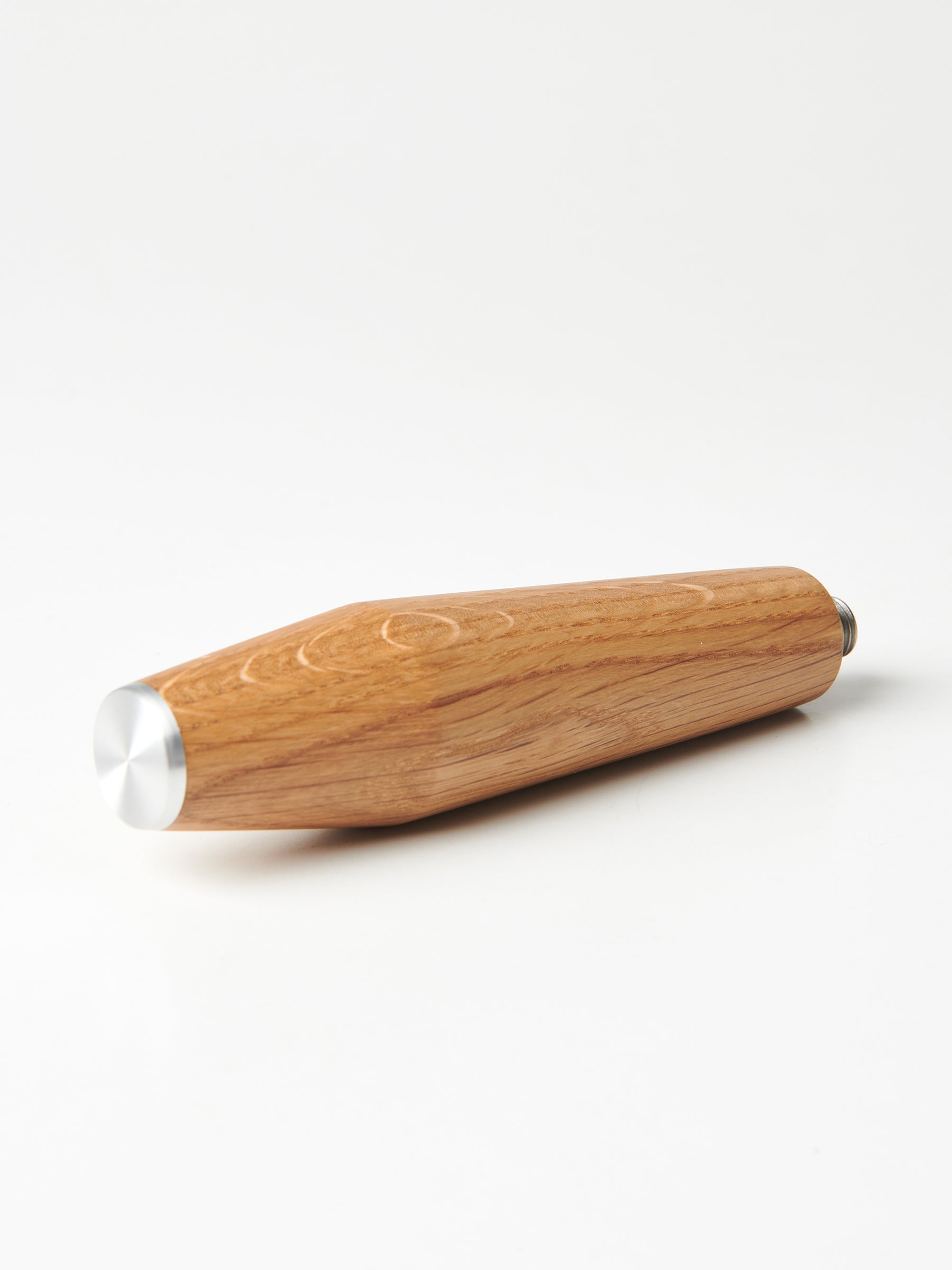 A bottomless Pesado portafilter with a Specht oak, stainless steel end-capped handle.