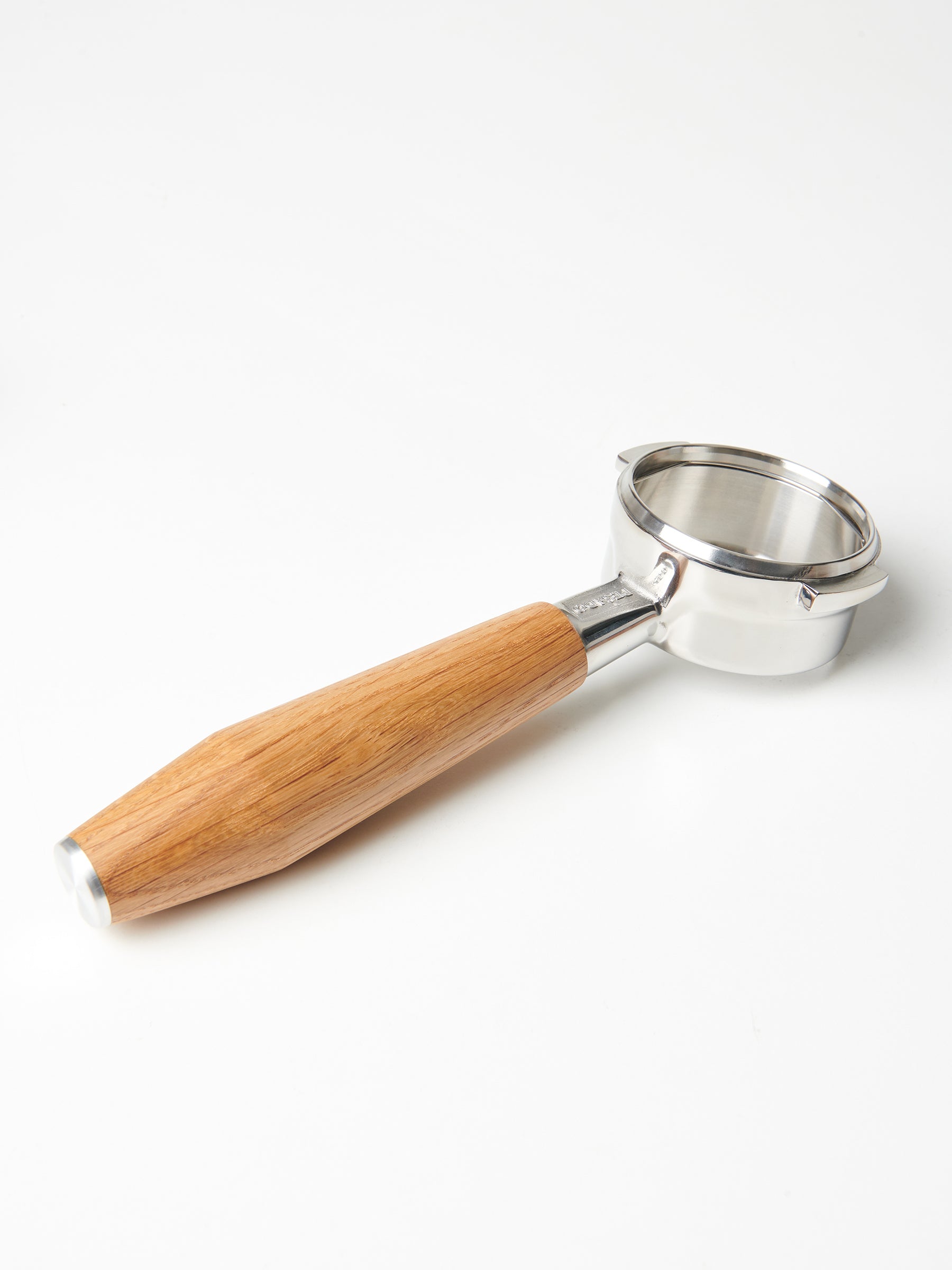 A bottomless Pesado portafilter with a Specht oak, stainless steel end-capped handle.