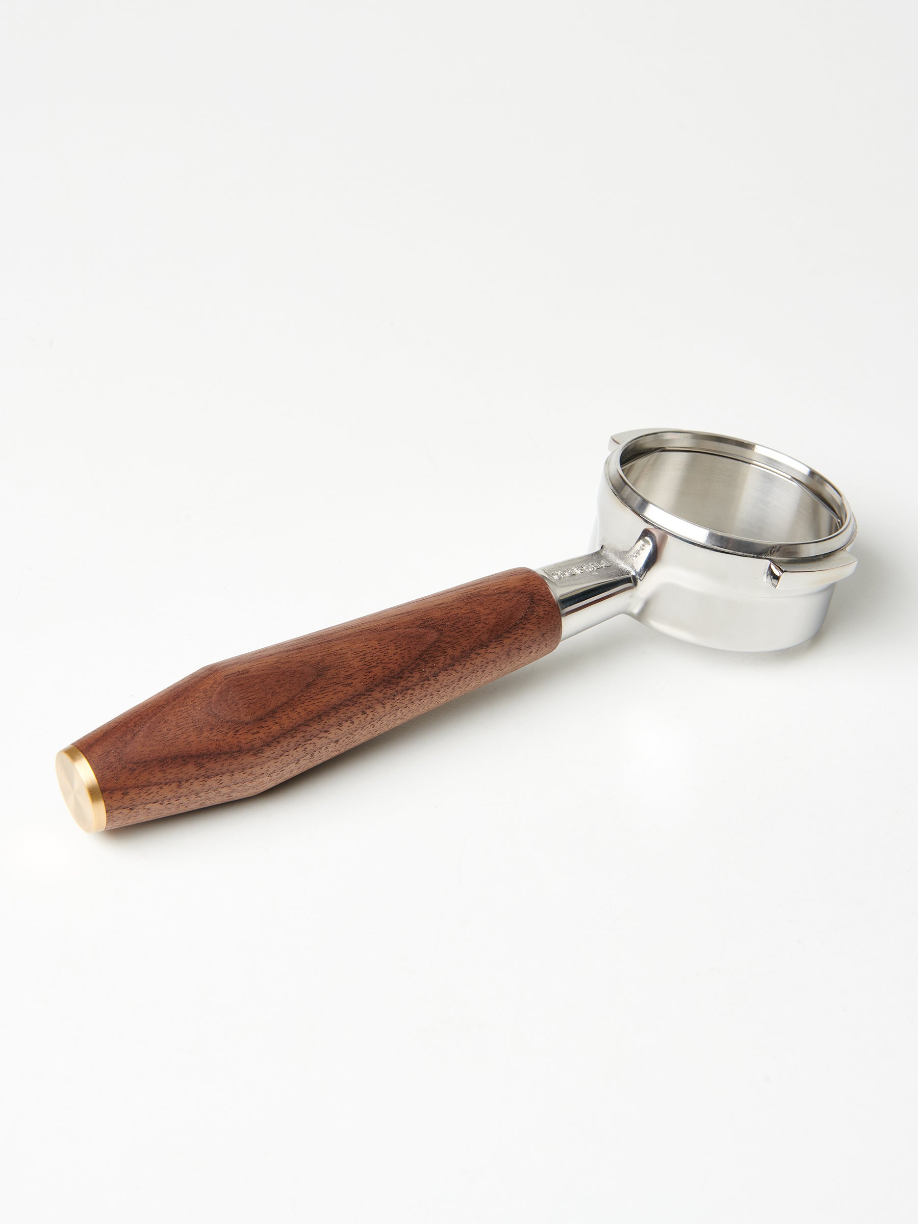 A bottomless Pesado portafilter with a Specht walnut, brass end-capped handle.